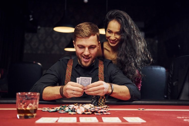 Live dealer dealing baccarat cards at gacortoto studio